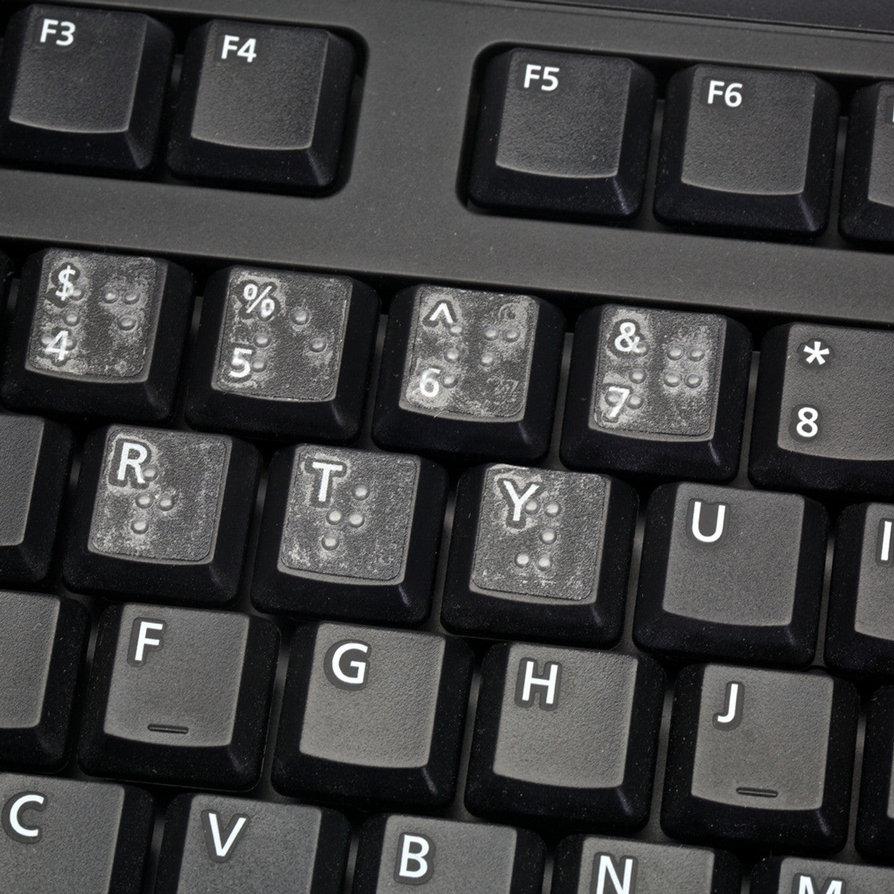 The Transparent Braille Keyboard Stickers are designed with transparent material and features Braille symbols corresponding to each key on the keyboard.