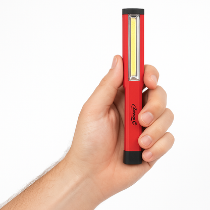 Close-up of a man's hand holding the Larry C COB LED Pocket Work Light with a transparent background