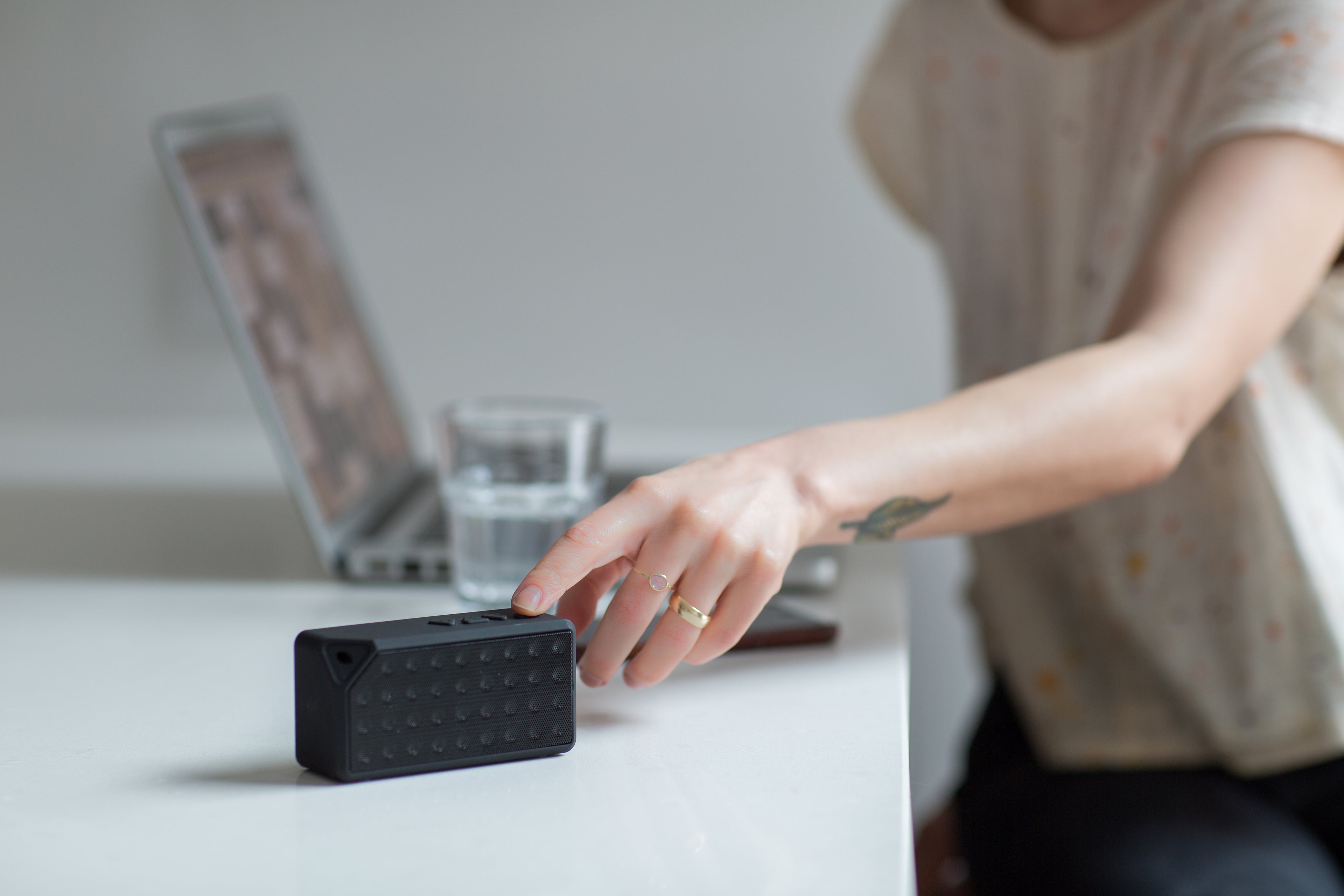 Woman touching a speaker